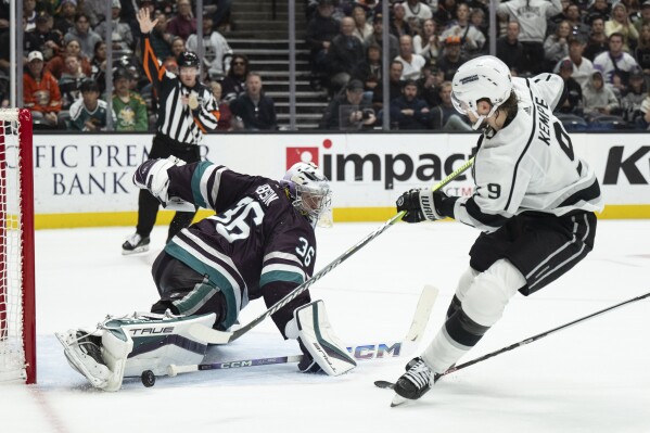 Anaheim Ducks goaltender John Gibson (36) blocks the shot by Los Angeles Kings center Adrian Kempe (9) during the second period of an NHL hockey game, Friday, Nov. 24, 2023, in Anaheim, Calif. (AP Photo/Kyusung Gong)