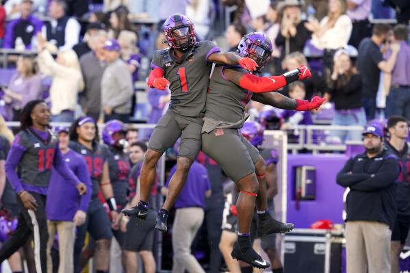 TCU cornerback Tre'Vius Hodges-Tomlinson (1) and defensive tackle Kenny Turnier, right, celebrate after Hodges-Tomlinson broke up a Baylor pass that was then intercepted by teammate cornerback Kee'Yon Stewart in the second half of an NCAA college football game in Fort Worth, Texas, Saturday, Nov. 6, 2021. (AP Photo/Tony Gutierrez)
