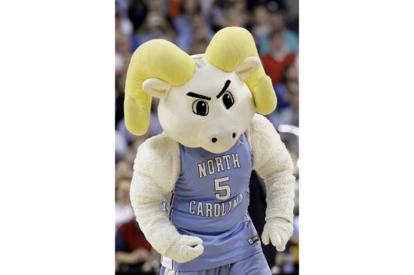 FILE - The North Carolina mascot Ramses is shown during the first half of a first-round men's NCAA college basketball tournament game in Greensboro, N.C., Thursday, March 19, 2009. Men’s college basketball traditional powers Kansas and North Carolina will play each other in regular-season games in 2024 and 2025. The first meeting will be Nov. 8, 2024, in Lawrence, Kansas. (AP Photo/Haraz N. Ghanbari, File)