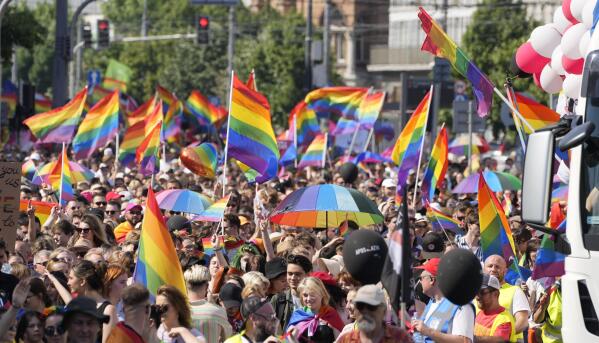 People take part in the Equality Parade, the largest gay pride parade in central and eastern Europe, in Warsaw, Poland, Saturday June 19, 2021. The event has returned this year after a pandemic-induced break last year and amid a backlash in Poland and Hungary against LGBT rights.(AP Photo/Czarek Sokolowski)