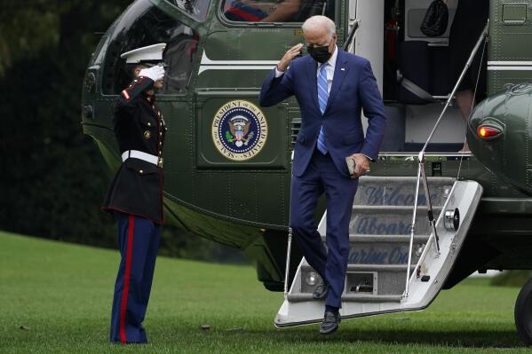 President Joe Biden salutes as he steps off of Marine One on the South Lawn of the White House in Washington, Monday, Oct. 11, 2021. He and first lady Jill Biden spent the weekend at their home in Wilmington, Delaware. (AP Photo/Susan Walsh)