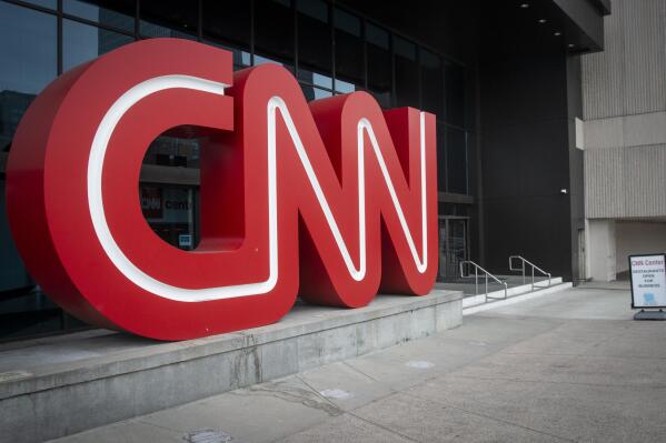 The CNN logo is displayed at the entrance to the CNN Center in Atlanta on Wednesday, Feb. 2, 2022. CNN’s Jeff Zucker’s abrupt exit this week after failing to disclose a workplace relationship is yet another reminder that companies should have a firm policy in place when workplace relationships arise, even in the C-Suite. (AP Photo/Ron Harris)