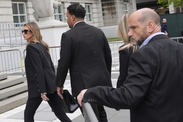 Interim US Attorney for New Jersey Alina Habba, left, arrives to the courthouse in Newark, N.J., Thursday, May 15, 2025. (AP Photo/Seth Wenig)