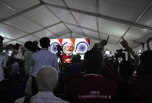 Indian Space Research Organization (ISRO) staff watch prime minister Narendra Modi speak after the successful landing of spacecraft Chandrayaan-3 on the moon at ISRO's Telemetry, Tracking and Command Network facility in Bengaluru, India, Wednesday, Aug. 23, 2023. (AP Photo/Aijaz Rahi)