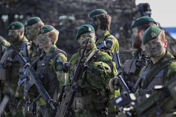 Swedish soldiers during the military exercise Aurora 23 at Berga naval base outside Stockholm, Friday, April 28, 2023. A Swedish parliament committee on Friday, April 26, 2024, said Sweden which recently joined NATO, should increase its military budget by nearly 54 billion kronor ($5 billion) until 2030 to strengthen the Scandinavian country's air defense and increase the number of conscripts, among others. (Anders Wiklund/TT News Agency via AP, File)