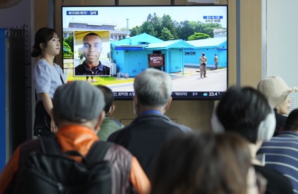 A TV screen shows a file image of American soldier Travis King during a news program at the Seoul Railway Station in Seoul, South Korea, Thursday, Sept. 28, 2023. Just over two months after he sprinted into North Korea across the heavily fortified inter-Korean border, King was put on a plane back to America after the North released him into U.S. custody. (AP Photo/Ahn Young-joon)