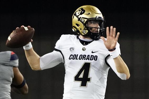 FILE - Colorado quarterback Sam Noyer (4) looks to pass against Arizona in the first half of an NCAA college football game against Arizona in Tucson, Ariz., in this Saturday, Dec. 5, 2020, file photo. Noyer has entered the transfer portal for a second time to close a career in Boulder that included three head coaches and a brief switch to safety. Noyer led the Buffaloes to a 4-2 record last season under first-year Colorado coach Karl Dorrell and a berth in the Alamo Bowl.(AP Photo/Rick Scuteri, File)