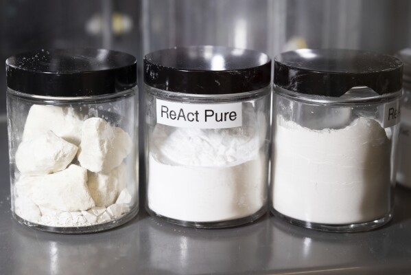 ReAct Pure, center, rests in a jar in the process lab at Fortera's facility in San Jose, Calif., Wednesday, April 10, 2024. The cement industry is one of the largest emitters of carbon dioxide and is responsible for about 8% of global emissions each year. Fortera, a clean tech company whose technology captures carbon emissions from kilns and feeds it back in to the process, is opening its first commercial scale operation on Thursday, April 12, 2024, in California. (AP Photo/Benjamin Fanjoy)