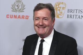 FILE - In this Friday, Oct. 25, 2019 file photo, Piers Morgan arrives at the BAFTA Los Angeles Britannia Awards at the Beverly Hilton Hotel in Beverly Hills, Calif. Britain’s media regulator has cleared TV personality and journalist Piers Morgan of any violations for making comments about Meghan, the Duchess of Sussex, that drew more than 50,000 viewer complaints. The Office of Communications says Morgan didn't breach the broadcasting code when he said on “Good Morning Britain” that he didn't believe what Meghan said during an interview with Oprah Winfrey. (Photo by Jordan Strauss/Invision/AP, file)
