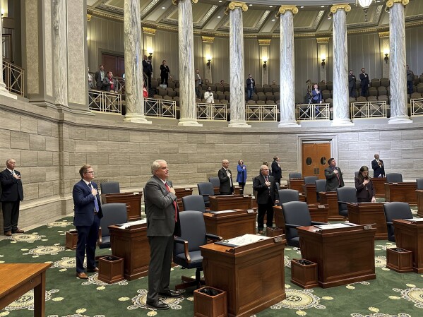 FILE - Missouri senators recite the Pledge of Allegiance as the chamber convenes its annual session on Jan. 3, 2024, in Jefferson City, Missouri. Disagreements over abortion rights, gun control and treatment of racial minorities are just some of the issues that have caused several political leaders to say they can’t take an oath or recite the Pledge of Allegiance. Some Republicans point to amendments enshrining abortion rights in state constitutions. Ohio's protections passed last fall, and advocates are proposing an initiative for the Missouri ballot this year. (AP Photo/David A. Lieb, File)