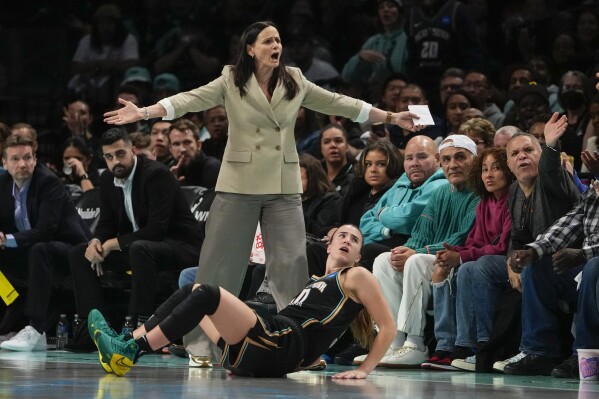 New York Liberty head coach Sandy Brondello and Sabrina Ionescu, below, react to a call during the second half in Game 4 of a WNBA basketball final playoff series against the Las Vegas Aces Wednesday, Oct. 18, 2023, in New York. The Aces won 70-69. (APPhoto/Frank Franklin II)
