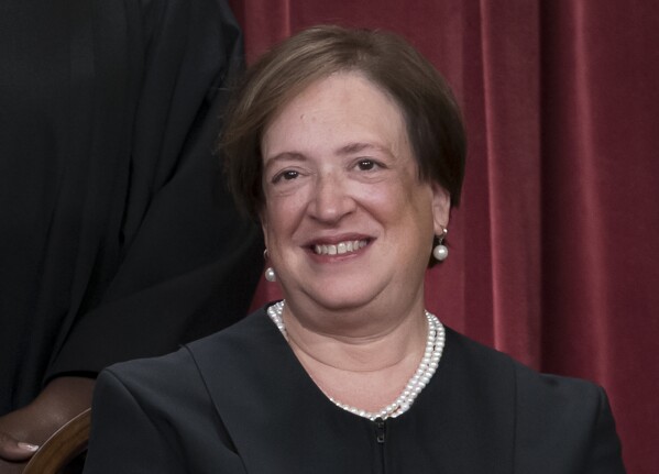 FILE - Supreme Court Justice Elena Kagan poses for a new group portrait, at the Supreme Court building in Washington, Oct. 7, 2022. Teaching is encouraged as a way to demystify the Supreme Court while exposing the justices to a cross-section of the public. Yet documents obtained by The Associated Press through public records requests reveal that some all-expense paid trips, particularly to attractive locales stateside and abroad, are light on classroom instruction, with ample time carved out for the justices' leisure. (AP Photo/J. Scott Applewhite, File)