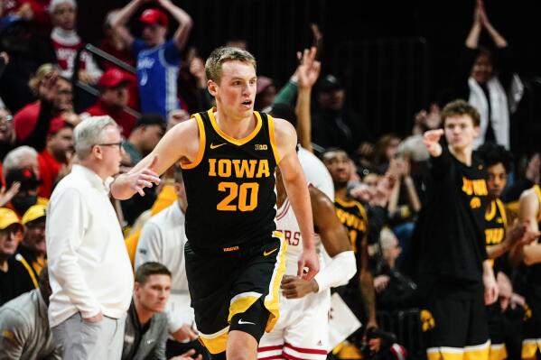 Iowa's Payton Sandfort (20) reacts after making a 3-point basket during the second half of an NCAA basketball game against Rutgers Sunday, Jan. 8, 2023, in Piscataway, N.J. (AP Photo/Frank Franklin II)