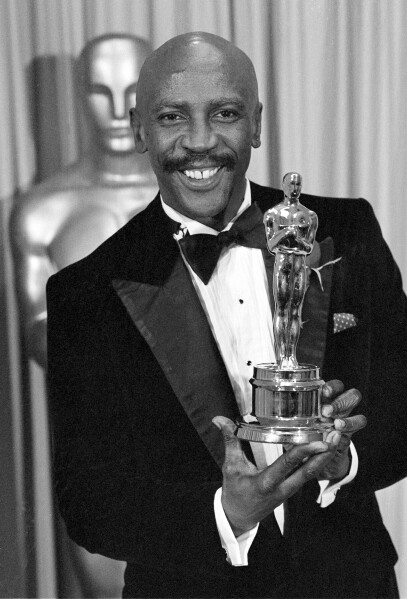 FILE - Louis Gossett Jr., poses with the Oscar for best supporting actor for his role in "An Officer and a Gentleman," at the annual Academy Awards presentation in Los Angeles on April 11, 1983. Gossett Jr., the first Black man to win a supporting actor Oscar and an Emmy winner for his role in the seminal TV miniseries “Roots,” has died. He was 87. (AP Photo, File)