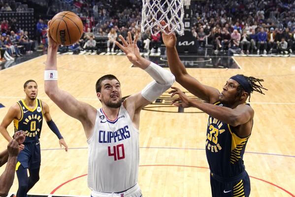 Los Angeles Clippers center Ivica Zubac (40) shoots as Indiana Pacers center Myles Turner (33) defends during the second half of an NBA basketball game Sunday, Nov. 27, 2022, in Los Angeles. (AP Photo/Mark J. Terrill)
