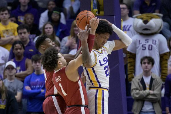 LSU forward Derek Fountain (20) gets tangled up with Alabama guard Mark Sears (1) and center Charles Bediako (14) during the first half of an NCAA college basketball game in Baton Rouge, La., Saturday, Feb. 4, 2023. (AP Photo/Matthew Hinton)