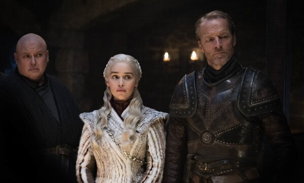 
              This image released by HBO shows from left Conleth Hill, Emilia Clarke, Iain Glen in a scene from "Game of Thrones," that aired Sunday, April 21, 2019. With the Game of Thrones' Jon Snow revealing his royal lineage to his potential rival Daenerys Targaryen, the beleaguered army at Winterfell is about to find out if two chief executives better than one. (Helen Sloan/HBO via AP)
            