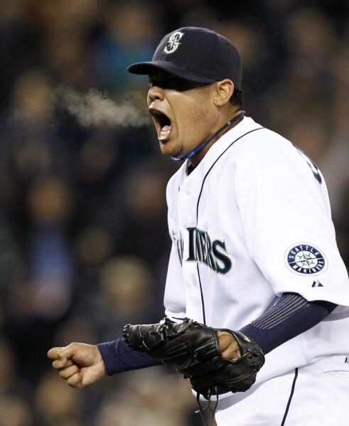 Seattle Mariners' starting pitcher Felix Hernandez gets ready to