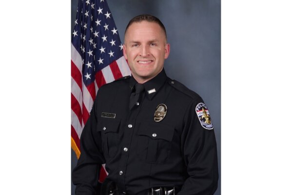 In this undated photo provided by the Louisville Police Department is officer, Brett Hankison. Louisville, Ky., Mayor Greg Fischer said Friday, June 19, 2020, that Hankison, who is one of three police officers involved in the March 13 fatal shooting of Breonna Taylor, will be fired. Two other officers remain on administrative reassignment while the shooting is investigated. (Louisville Police Department via AP)