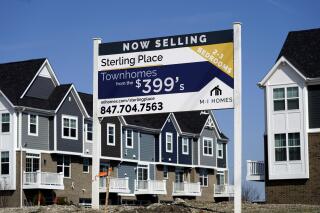 This March 21, 2021 photo shows an advertising sign for building land stands in front of a new home construction site in Northbrook, Ill. Mortgage rates were mostly lower this week, Thursday, June 17,  as the economy continued to show signs of recovery from the pandemic recession and recent bursts of inflation were deemed temporary by federal policymakers.   (AP Photo/Nam Y. Huh)