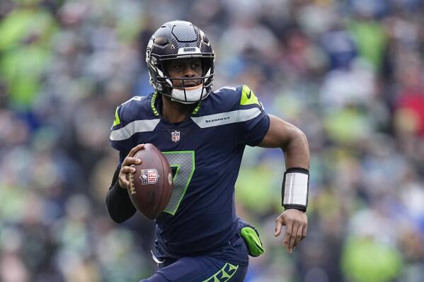 Geno Smith gets the spotlight after new deal with Seahawks | AP News