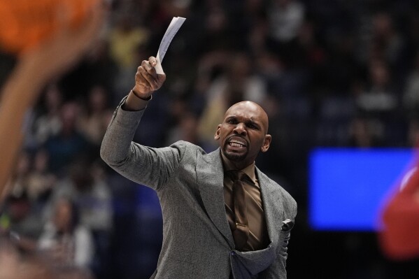 Vanderbilt head coach Jerry Stackhouse reacts on the sidleine during the first half of an NCAA college basketball game againnst Arkansas at the Sotheastern Conference tournament Wednesday, March 13, 2024, in Nashville, Tenn. (AP Photo/John Bazemore)