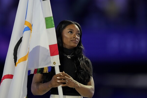 Simone Biles during the ceremony in Saint-Denis, France. (AP Photo/Natacha Pisarenko)