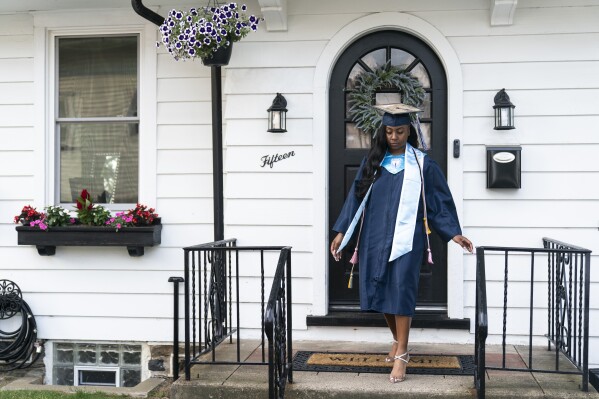 Nylla Miller departs for her high school graduation ceremony from her home in Aldan, Pa., Thursday, June 15, 2023. (AP Photo/Matt Rourke)