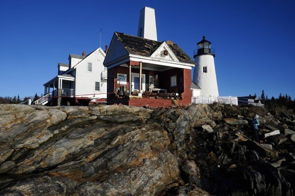 The iconic bell tower building at Pemaquid Point Light stands with makeshift modifications, Thursday, Jan. 11, 2024, in Bristol, Maine, the day after being pummeled by damaging winds and waves from powerful storm. The lighthouse represents Maine on its state quarter. (AP Photo/Robert F. Bukaty)