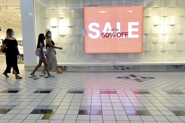 FILE - In this Aug. 11, 2020 file photo, shoppers walk through the Valley Mall in Halfway, Md.  U.S. consumer confidence fell for second straight month in August as a resurgence of virus cases in many parts of the country heightened pessimism about the economy. (Colleen McGrath/The Herald-Mail via AP, File)