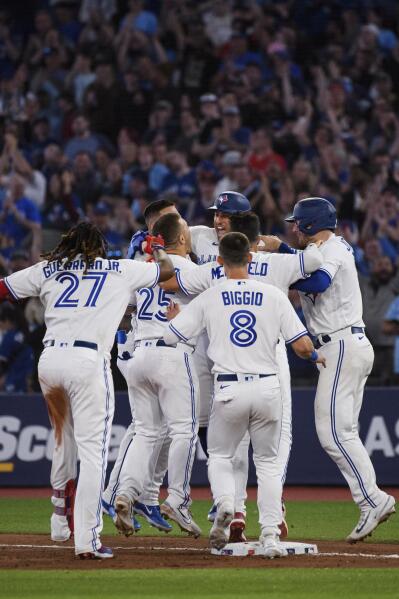 Chapman's 2 home runs help Blue Jays fend off Tigers for 8th