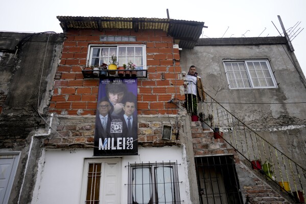 Andrés Ferreira, follower of presidential hopeful Javier Milei, poses for a photo at his home in the Fiorito neighborhood of Buenos Aires, Argentina, Saturday, Sept. 23, 2023. Ferreira is particularly angry about pervasive political corruption. (AP Photo/Natacha Pisarenko)