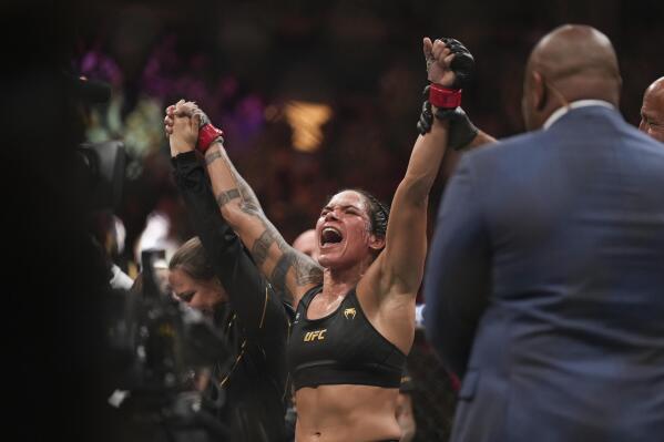 Amanda Nunes celebrates after defeating Irene Aldana during a UFC 289 women's bantamweight title bout, in Vancouver, British Columbia, on Saturday, June 10, 2023. (Darryl Dyck/The Canadian Press via AP)