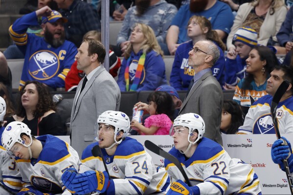 Buffalo Sabres head coach Don Granato, right, looks up as right wing JJ Peterka, not in picture, scores a goal during the third period of an NHL hockey game against the San Jose Sharks, Saturday, Jan. 27, 2024, in San Jose, Calif. (AP Photo/Josie Lepe)