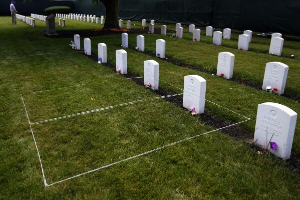 FILE - Headstones are seen at the cemetery of the U.S. Army's Carlisle Barracks, June 10, 2022, in Carlisle, Pa. When two Native American boys from Nebraska died after being taken to the notorious boarding school hundreds of miles away in Pennsylvania, they were buried there without notice. Nearly 130 years later, the tribe wants the boys' remains back home. So far, the Army has refused to return the remains of Samuel Gilbert and Edward Hensley. (AP Photo/Matt Slocum, File)