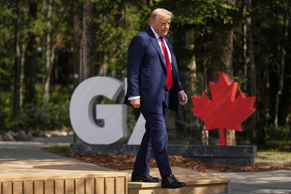 President Donald Trump walks during the official welcome of the G7 Summit, Monday, June 16, 2025, in Kananaskis, Canada. (AP Photo/Mark Schiefelbein)