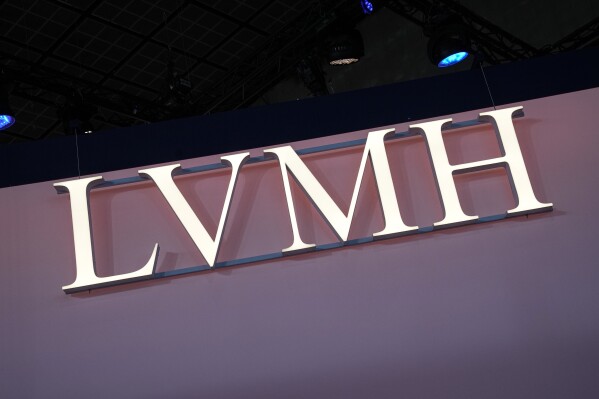 FILE - The LVMH logo is photographed at the Vivatech show in Paris, June 15, 2023. The world’s biggest luxury group, LVMH Moët Hennessy Louis Vuitton, officially announced a sponsorship deal Monday, July 24, 2023 with the 2024 Paris Olympics and Paralympics, joining the ranks of top-tier French sponsors such as banking group BPCE, pharmaceutical maker Sanofi and supermarket operator Carrefour. (AP Photo/Michel Euler, File)