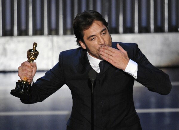 Spanish actor Javier Bardem accepts the Oscar for best supporting actor for his work in "No Country for Old Men" at the 80th Academy Awards Sunday, Feb. 24, 2008, in Los Angeles. (AP Photo/Mark J. Terrill)