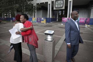 Mayoral contenders Pamela Moses, second left, and Lemichael Wilson attend a May Day Rally outside City Hall, May 1, 2019, in Memphis, Tenn. Moses, a Tennessee activist has been sentenced to six years and a day in prison after she was convicted of illegally registering to vote in 2019 while on probation for previous felonies. Some legal experts see the sentence as baffling and excessive. The district attorney's office in Memphis says Moses was sentenced on Jan. 31, 2022, by Shelby County Criminal Court Judge W. Mark Ward. (Jim Weber/Daily Memphian via AP)