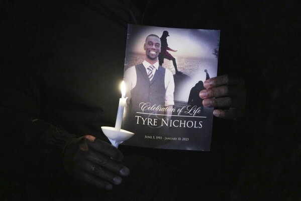 A crowd gathers to remember Tyre Nicholas during a candlelight vigil on the anniversary of his death Sunday, Jan. 7, 2024, in Memphis, Tenn. (AP Photo/Karen Pulfer Focht, File)