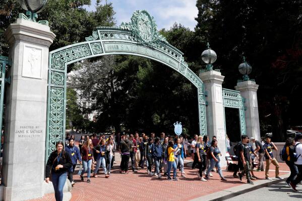 FILE - In this Aug. 15, 2017 photo, students walk on the University of California, Berkeley campus in Berkeley, Calif. California's Supreme Court has ordered the University of California, Berkeley on Thursday, March 3, 2022, to freeze its undergraduate enrollment at 2020-21 levels, denying its petition against a lower court ruling. That means the university will have to accept at least 3,000 fewer students than planned for the upcoming academic year. (AP Photo/Marcio Jose Sanchez, File)