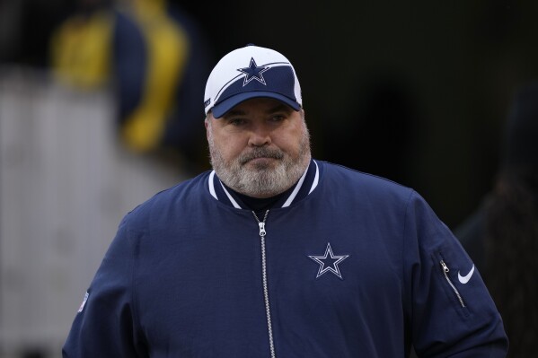Dallas Cowboys head coach Mike McCarthy taking the field before the start of the first half of an NFL football game against the Washington Commanders, Sunday, Jan. 7, 2024, in Landover, Md. (AP Photo/Susan Walsh)