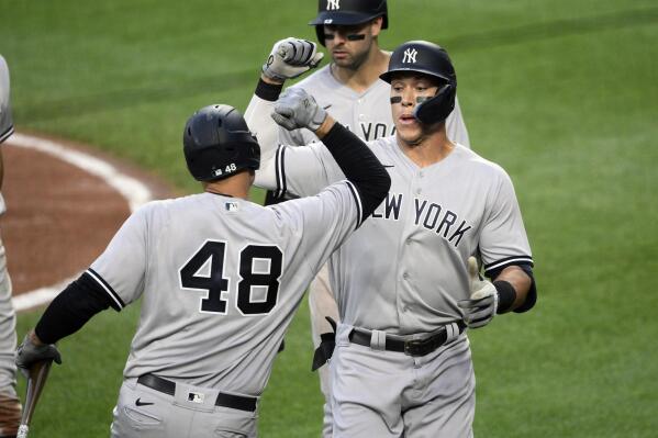 New York Yankees' Aaron Judge, right, celebrates his three-run home run with Anthony Rizzo (48) during the third inning of a baseball game against the Baltimore Orioles, Friday, July 22, 2022, in Baltimore. (AP Photo/Nick Wass)