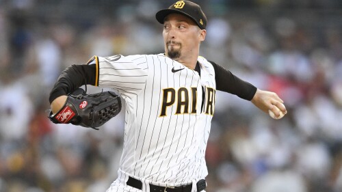 San Diego Padres starting pitcher Blake Snell delivers during the first inning of a baseball game against the Los Angeles Angels, Monday, July 3, 2023, in San Diego. (AP Photo/Denis Poroy)