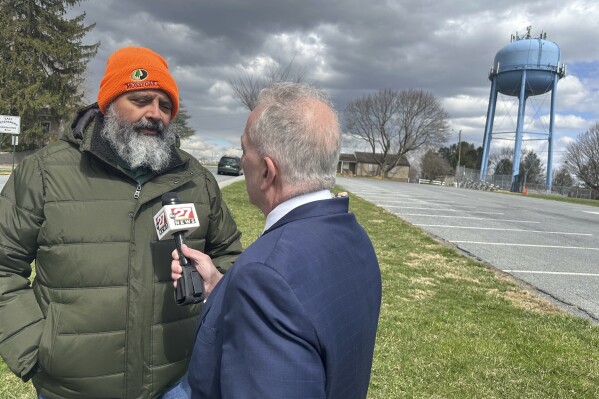 State Senate special election winner James Andrew Malone, a Democrat, does a television interview in East Petersburg, Pa., Wednesday, March 26, 2025. (AP Photo/Mark Scolforo)
