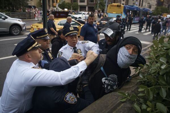 Police arrest a pro-Palestinian protester during the Met Gala at the Metropolitan Museum of Art, Monday, May 6, 2024, in New York. (AP Photo/Andres Kudacki)