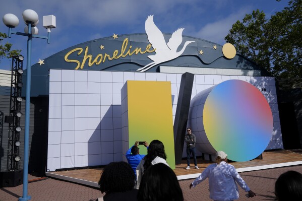People take photos at a Google I/O event in Mountain View, Calif., Tuesday, May 14, 2024. (AP Photo/Jeff Chiu)