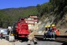 Rescuers rest at the site of an under-construction road tunnel that collapsed in Silkyara in the northern Indian state of Uttarakhand, Friday, Nov. 24, 2023. Rescuers are racing to evacuate 41 construction workers who have been trapped for nearly two weeks. (AP Photo)