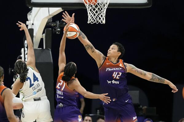 Phoenix Mercury forward Brianna Turner (21) and center Brittney Griner (42) defend against Minnesota Lynx forward Napheesa Collier (24) during the second half of a WNBA basketball game Thursday, May 25, 2023, in Phoenix. (AP Photo/Ross D. Franklin)