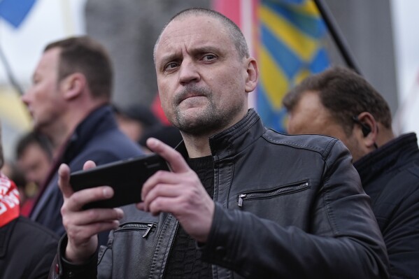 Sergei Udaltsov, Russian left-wing political activist attends a rally of communists party supporters marking the 106th anniversary of the 1917 Bolshevik revolution near Red Square, in Moscow, Russia, on Tuesday, Nov. 7, 2023. Russian left-wing activist Sergei Udaltsov has been charged with justifying terrorism on social media, the state-run news agency RIA Novosti reported. (AP Photo/Alexander Zemlianichenko)